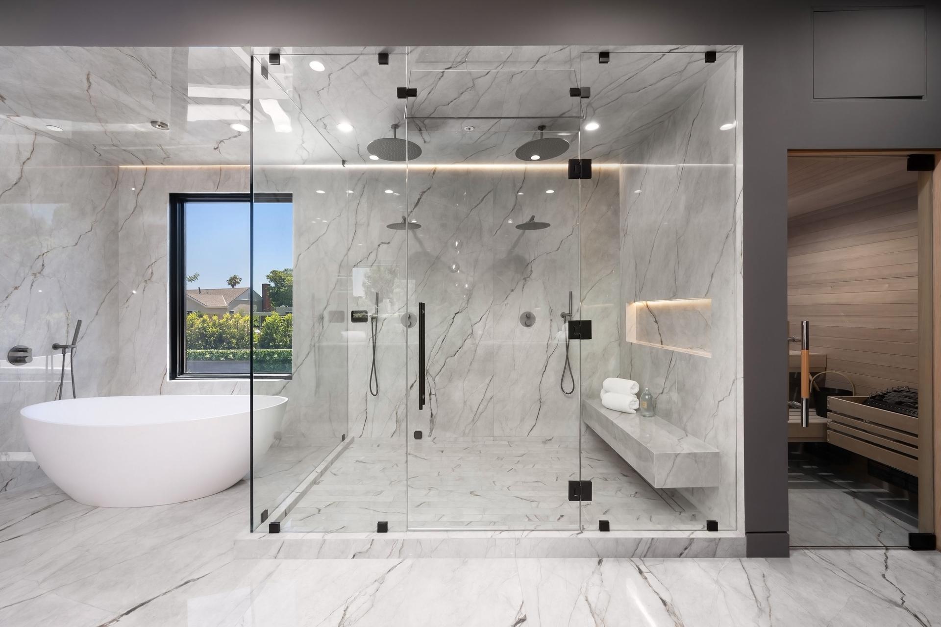 Modern luxury bathroom with glass shower and sauna